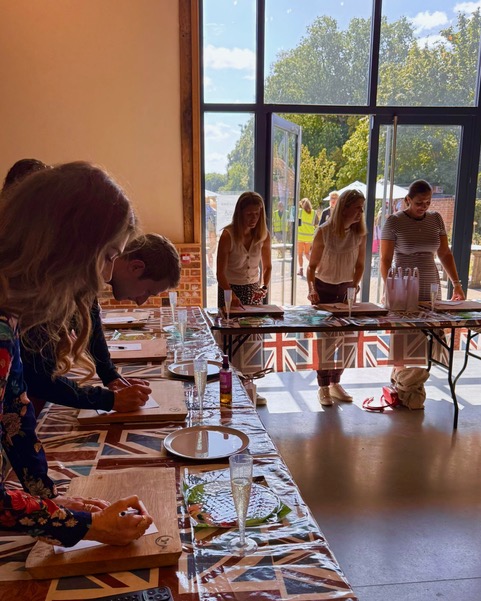 Guests signing personalised recipe cards at a Luma House workshop